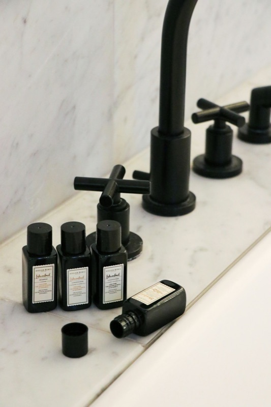 Refillable dispensers on a hotel bathroom sink