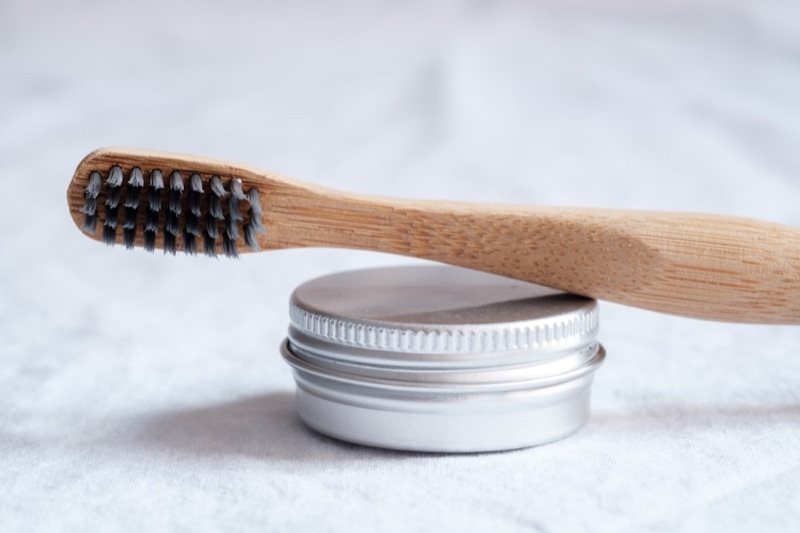 Kids bamboo toothbrush on a neutral background